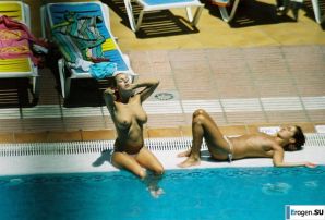 Girls sunbathe topless near the pool. Thumb 4