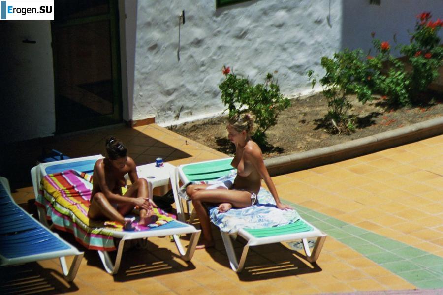 Girls sunbathe topless near the pool. Part 2. Photo 2