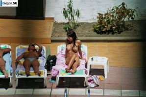 Girls sunbathe topless near the pool. Part 2. Thumb 3