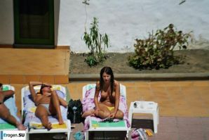 Girls sunbathe topless near the pool. Part 2. Thumb 4