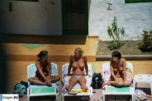 Girls sunbathe topless near the pool. Part 3. Thumb 4