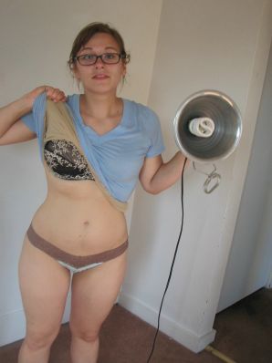 A girl with large breasts poses in clothes and then undresses. Thumb 1