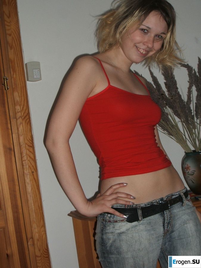A blonde with a thin waist poses in glasses and red panties. Part 2. Slide 1