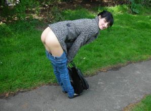 A fragile brunette shows her ass on the street and at home. Thumb 3