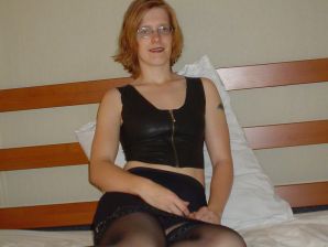 A red-haired student with glasses spread her legs in lace stockings and showed a pussy. Part 2. Thumb 1